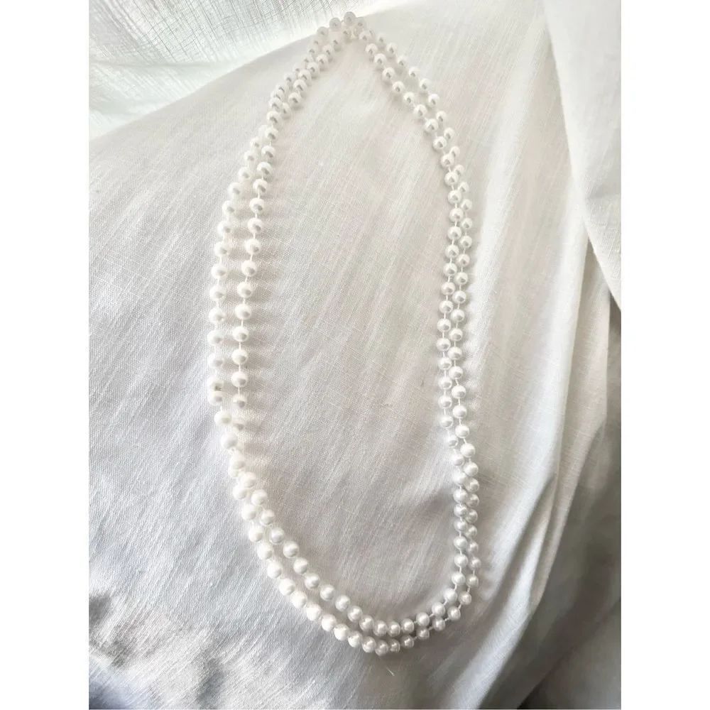 Long white faux pearl necklace